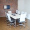 Ready for the next meeting. a conference table and chairs in an empty boardroom.