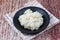 Ready sticky rice served on bamboo background.