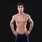 Ready for the swimming lane. Studio shot of a muscular young swimmer.