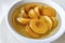 Ready to eat apricot compote in a white bowl