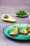 Ready-to-eat bruschettas with salmon, butter, avocado and arugula