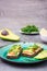 Ready-to-eat bruschettas with salmon, butter, avocado and arugula