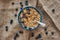 Ready to eat. Top view of muesli bowl with blueberries.