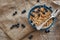 Ready to eat. Top view of muesli bowl with blueberries.