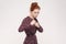 Ready to fight! Aggressive redhead women with bun hair looking a