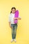 Ready to ride. Kid girl happy carries penny board. Child likes skateboarding with penny board. Modern teen hobby. How to