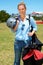 Ready to soar. a young woman walking with her parachuting gear.