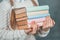 Ready to study hard Strong smart girl is holding books and is isolated on grey background.