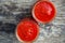 Ready tomato paste in a jar on the table. Tomato ketchup sauce in a glass bowl.