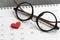 Ready for valentine`s day concept with eyeglasses and red lovely
