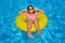 Real adorable girl relaxing in swimming pool