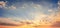 Real amazing panoramic sunrise or sunset sky with gentle colorful clouds