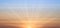 Real amazing panoramic sunrise or sunset sky with gentle colorful clouds. Long panorama, crop it. Evening sky scene with golden
