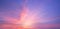 Real amazing panoramic sunrise or sunset sky with gentle colorful clouds. Long panorama, crop it. Evening sky scene with golden