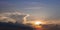 Real amazing panoramic sunrise or sunset sky with gentle colorful clouds. Long panorama, crop it. Evening sky scene with golden