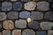 Real backround: grey stone pavement with golden knight`s cross