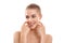 Real beauty. Portrait of a beautiful half naked blond woman with short hair touching her cheeks with hands and looking