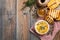 A real Camembert from France with thyme, honey and toasted bread on old wooden rustic table. Soft cheese on a wooden background wi