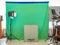 Real empty green screen Chroma key film/photo studio