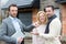 Real estate agent delivers keys to young atractive couple