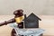 Real estate concept -auction gavel and little house with copy space