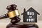 Real estate concept auction gavel and little house with inscription Buy or Rent