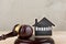 Real estate concept -auction gavel and little house with inscription Deposit