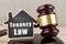 Real estate concept -auction gavel and little house with inscription Tenancy law