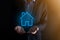 Real estate concept  businessman holding a house icon.House on Hand.Property insurance and security concept. Protecting gesture of