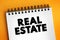 Real estate - form of real property, land along with any permanent improvements attached to the land, including water, trees,