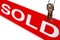 Real Estate House Keys and Realtor Sold Sign