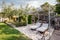 Real estate photography villa yard garden, beach lounge chairs, hanging suspended plants