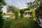 Real estate photography villa yard garden, hanging suspended plants