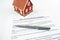 Real estate purchase agreement contract with tiny red model house