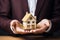 Real estate retiree man agent hands holding house model insurance businessman investing private property mortgage home