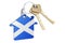 Real estate in Scotland. Home keychain with Scottish flag. Property, rent or mortgage concept. 3D rendering