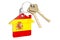 Real estate in Spain. Home keychain with Spanish flag. Property, rent or mortgage concept. 3D rendering