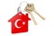 Real estate in Turkey. Home keychain with Turkish flag. Property, rent or mortgage concept. 3D rendering