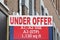 Real estate under offer sign