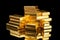 real gold bars stacked on a mirrored surface