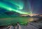 Real Magic of Northern Lights - Norwegian fjord with snow and mountains