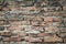 Real medieval brick wall surface can use as background pattern or texture with real light at old town Songkhla Thailand