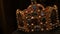 Real old vintage antique royal crown for official coronations, decorated with gold, diamonds, rubies, sapphires and