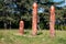 Real pagan altar in the forest with idols in summer light.