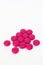 Real pink medicine pill drug tablet group on white background