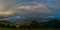 Real rainbow above a small village