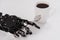 Real robot hand with spoon and white cup of coffee. Concept of robotic process automation