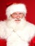 Real Santa Claus pointing on red studio background