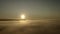 Real slow fly above foggy clouds sunset and then going down to landing through thick air