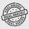 Real smoke rubber stamp isolated on white.